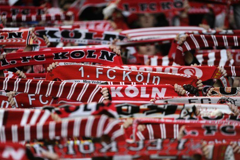 Supporters of German Football Bundesliga Club FC Koln (Cologne) present their scarves