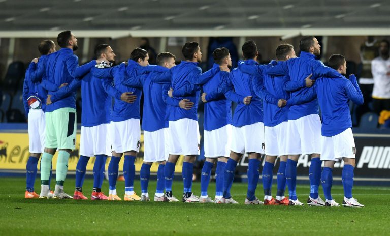 Italian football team players embrace each other during the national anthem, before the Nations League's match Italy vs Netherlands, in Bergamo.