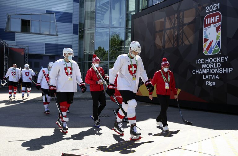 Riga, Latvia. 31st May, 2021. Players of the Swiss national team leave an arena as they go to the Daugava Arena for a training session during the 2021 IIHF World Championship Group Stage. Ice hockey players go to training sessions in full kit due to a ban