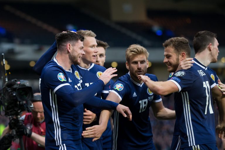 Hampden Park, Glasgow, UK. 8th June, 2019. European Championships, International football, Scotland versus Cyprus; Oliver Burke of Scotland is congraulated after scoring for 2-1 in the 89th minute by Scott McTominay, Stuart Armstrong and Ryan Fraser Credi