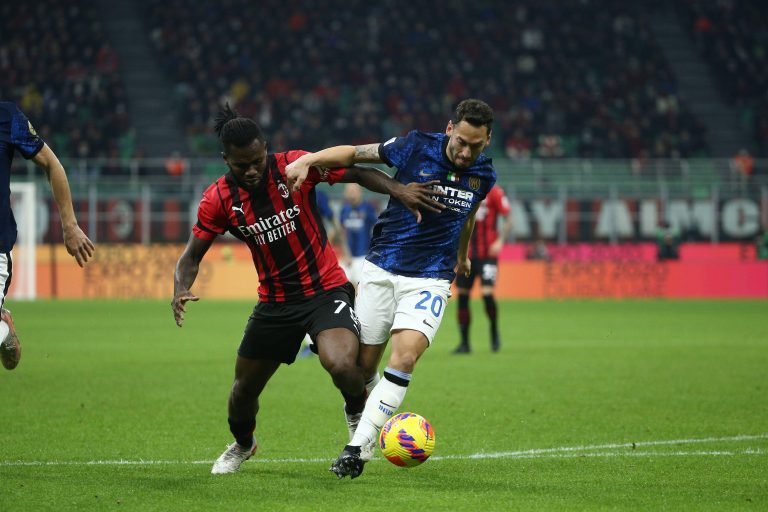 Frank Kessie of AC Milan and Hakan Calhanoglu Inter FCI in action during the Serie A 2021/2022 match between AC Milan and Inter FCI at Giuseppe Meazza