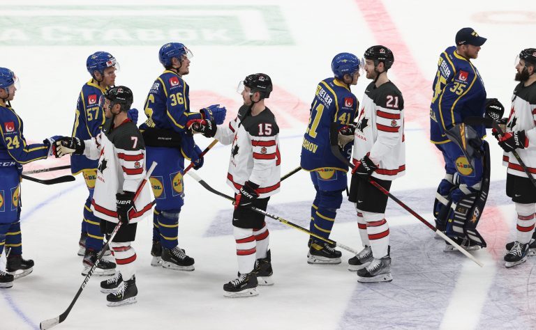 Moscow, Russia. 17th Dec, 2021. Players shake hands after a 2021 Channel One Cup ice hockey match between the national teams of Canada and Sweden at CSKA Arena as part of the 2021/22 Euro Hockey Tour. Credit: Valery Sharifulin/TASS/Alamy Live News