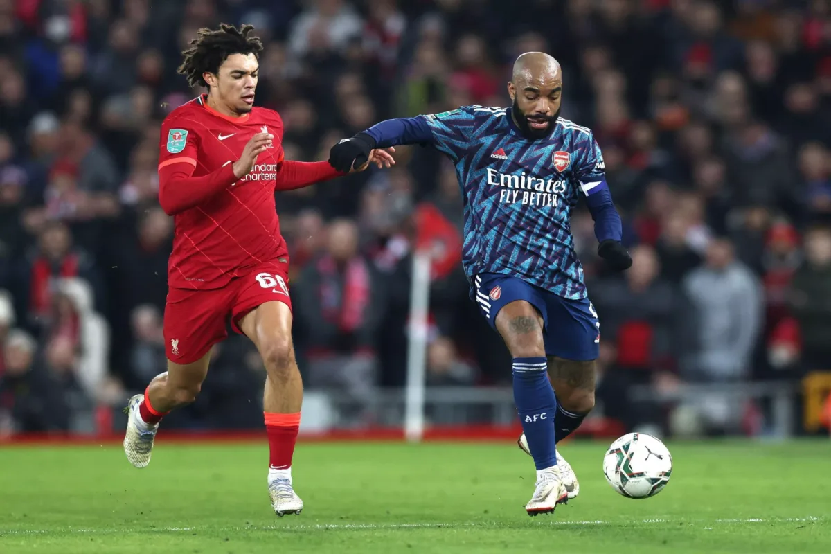 Liverpool, UK. 13th Jan, 2022. Alexandre Lacazette of Arsenal (R) is challenged by Trent Alexander-Arnold of Liverpool during the Carabao Cup match at Anfield, Liverpool. Picture credit should read: Darren Staples/Sportimage Credit: Sportimage/Alamy Live