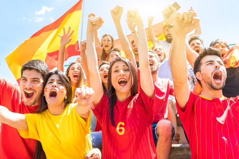 Spanish supporters celebrating and cheering at stadium Spanish supporters celebrating and cheering at stadium