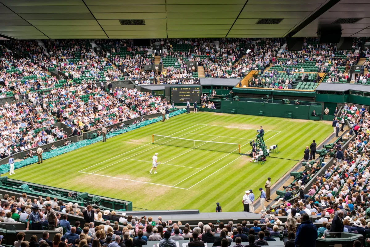 View of Centre Court full of spectators watching a game at Wimbledon All England Lawn Tennis Club Championships. Wimbledon. tennis wimbledon